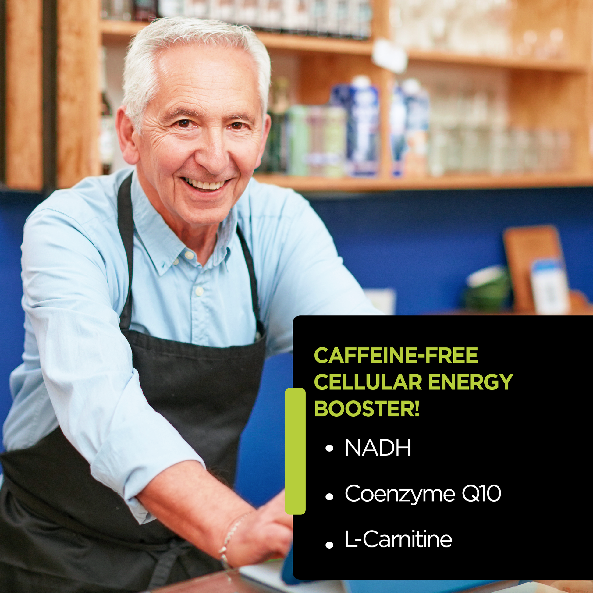 Smiling senior man in apron standing in health food store with cellular energy booster advertisement.