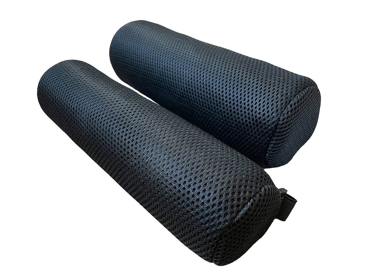 Two black foam rollers for fitness and physical therapy on black background